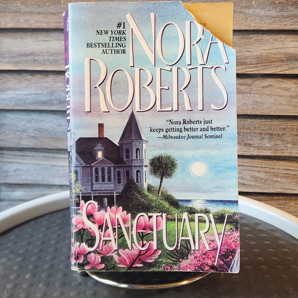🔥 Nora Roberts Sanctuary Paperback Book Torn Corner